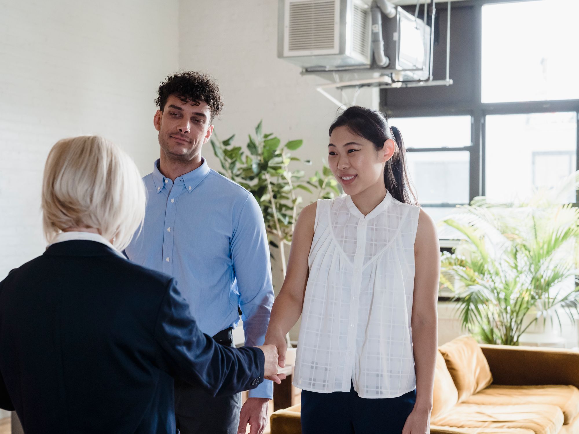 An agent showing an apartment to a prospective buyer